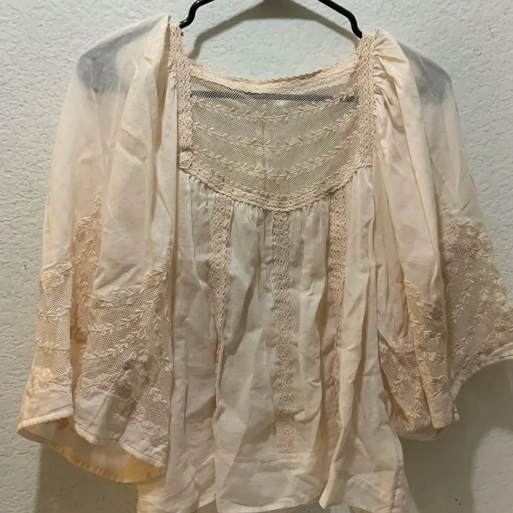 Anthropologie eyelet bell sleeve peasant top